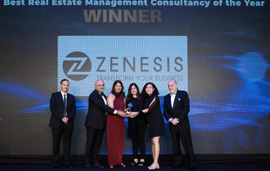 Zenesis representatives holding company award