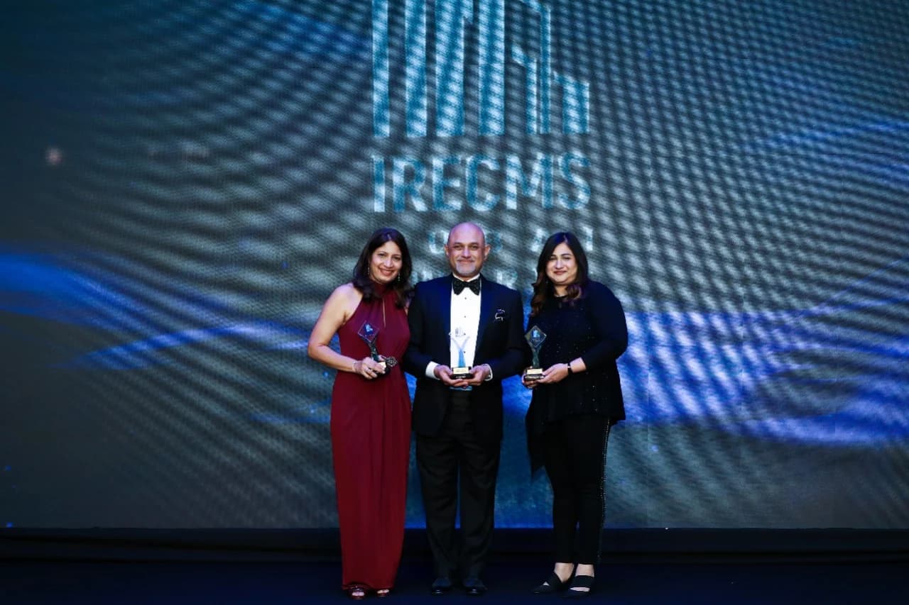 Cecilia D'Cunha and the Zenesis team holding awards at IRECMS Dubai